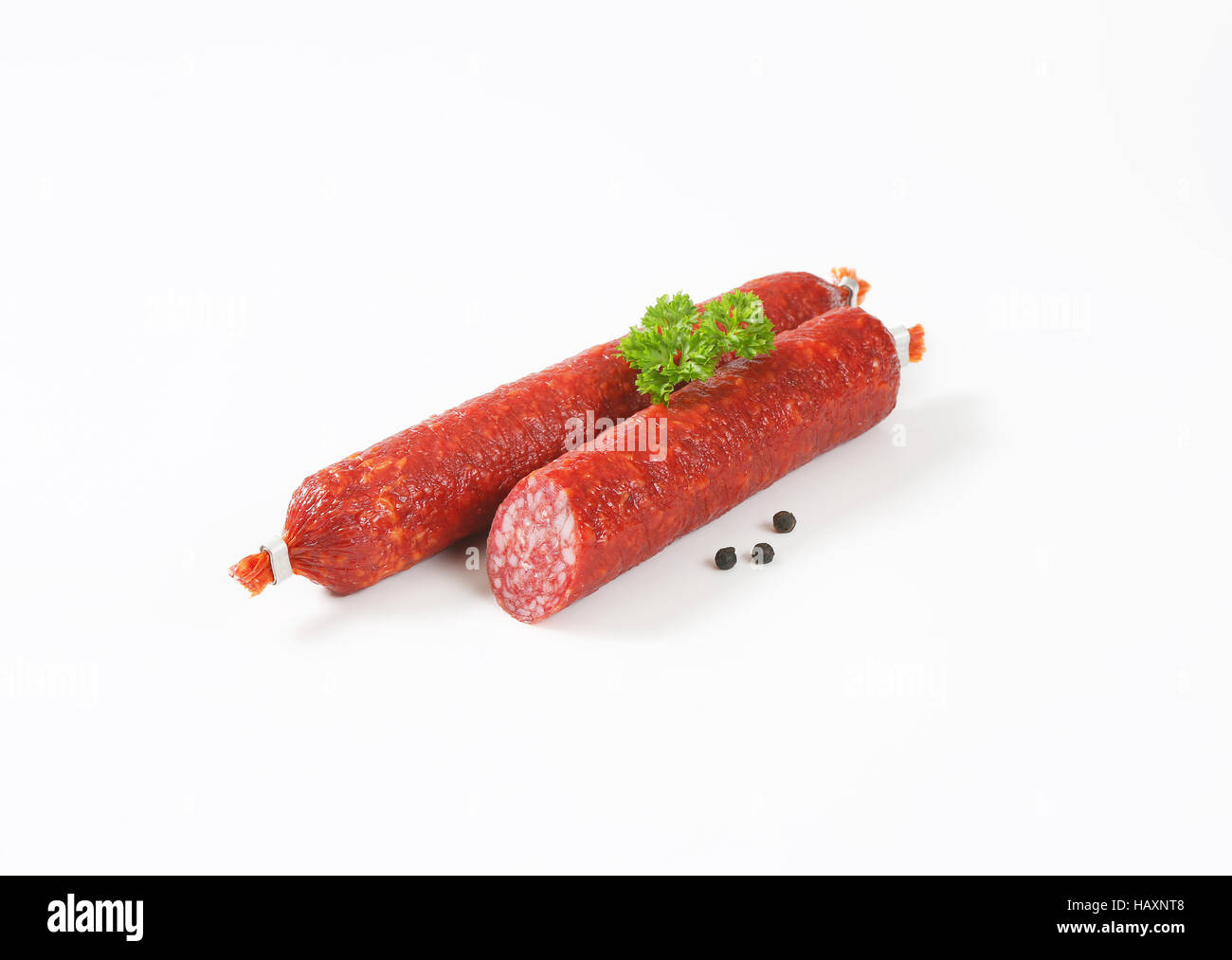 Smoked sausage salami on white background Stock Photo Alamy