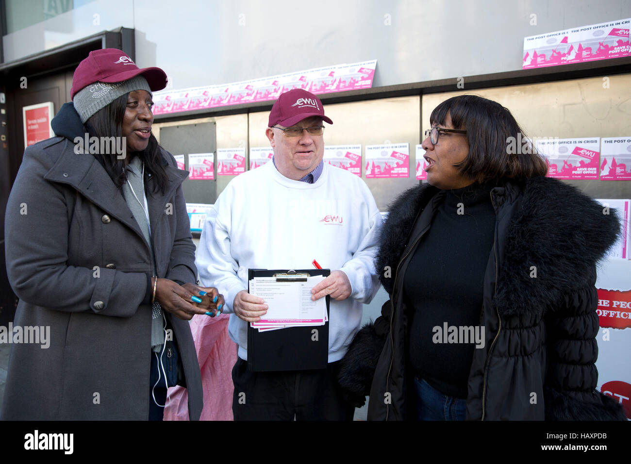 Shadow home secretary Diane Abbott (right), MP for Hackney North and Stoke Newington, visits members of the Communication Workers Union on the picket line outside a closed Post Office in Hackney, east London, as members of the CWU and Unite are staging a 24-hour strike in disputes over pensions, jobs and closures. Stock Photo