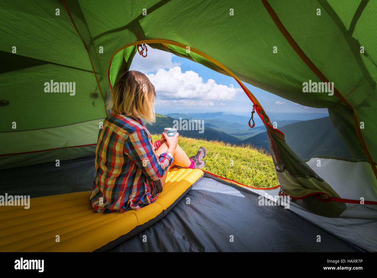 girl with cup in summer mountains Stock Photo