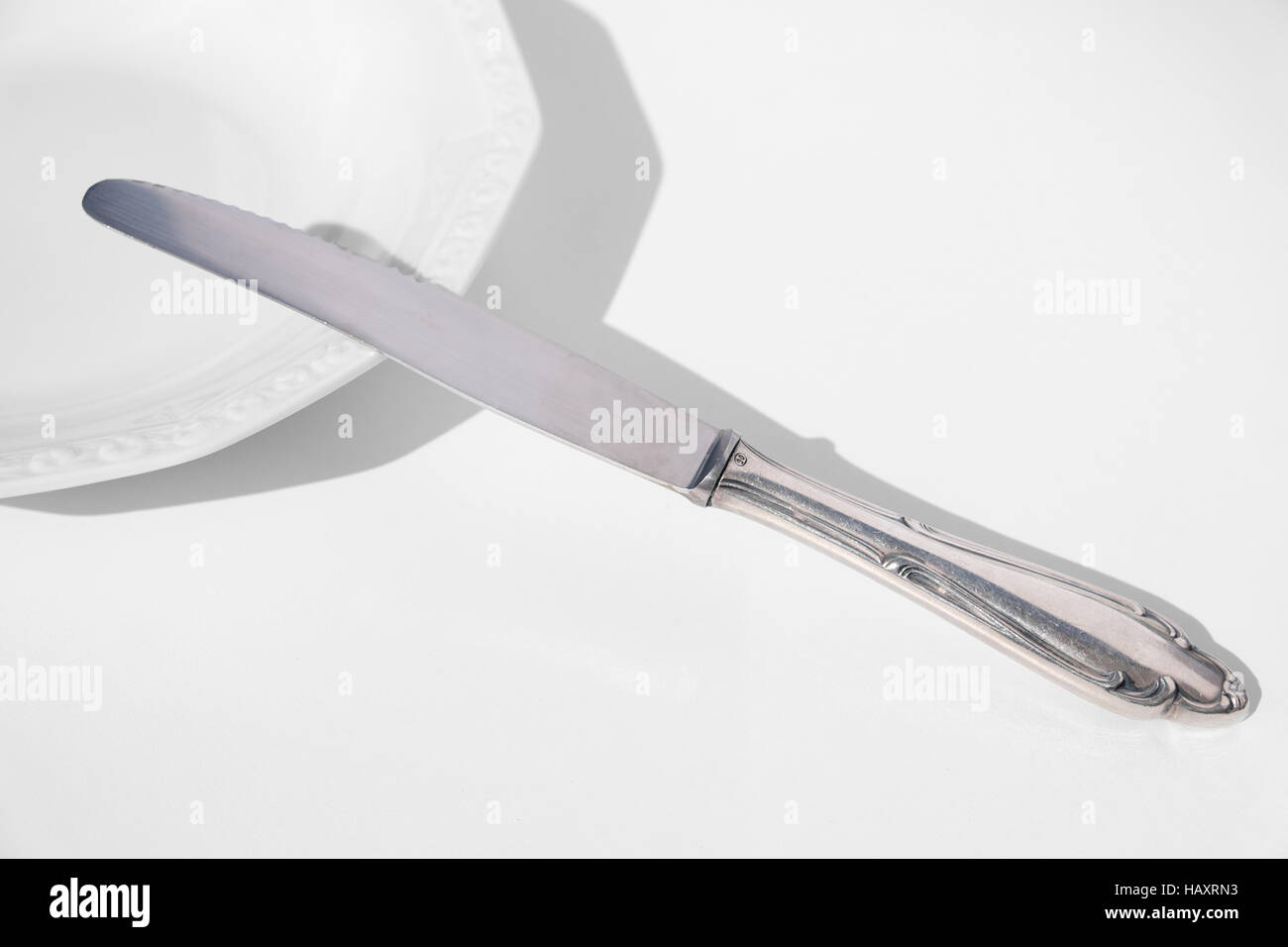 empty plate and knife isolated - copy space Stock Photo