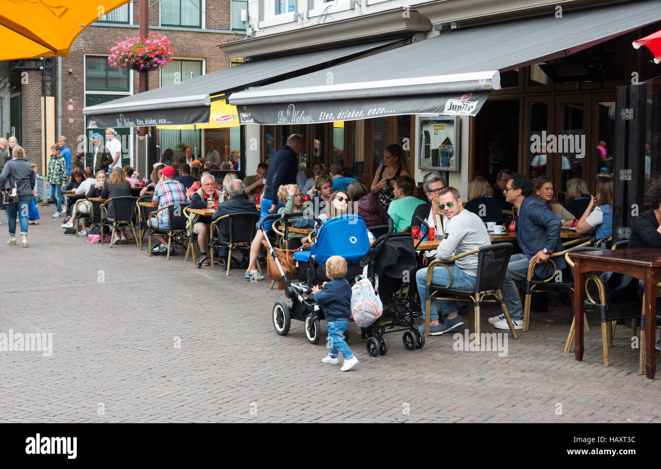 SNEEK,HOLLAND - AUGUST 08 2016: people enjoy their drinks and food on the teracce at the market on August 08, 2016 in Sneek,Holland,Sneek is very popu Stock Photo