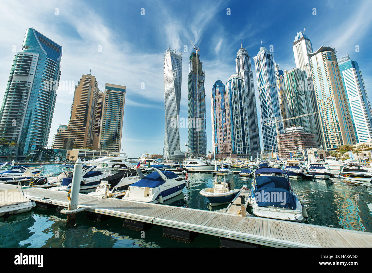 DUBAI, UNITED ARAB EMIRATES - FEBRUATY 29, 2016: Dubai Marina skyscrapers, port with luxury yachts and marina promenade,Dubai,United Arab Emirates Stock Photo