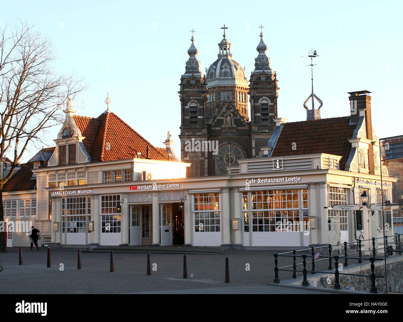 Amsterdam Tourist Office on Stationsplein square in central Amsterdam,  Netherlands. In background Basilica of Saint Nicholas Stock Photo - Alamy