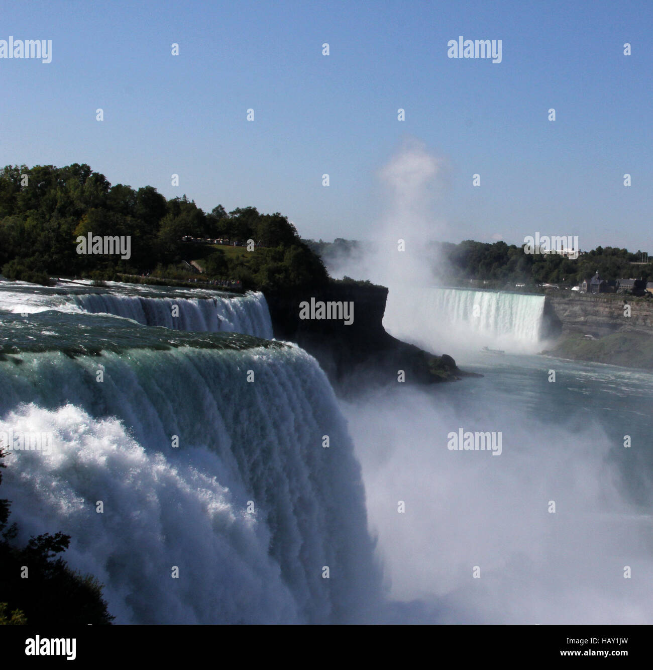 Horseshoe Falls and Bridal Veil Falls at Niagara Falls taken from Niagara Falls State Park on the American side with rising mist Stock Photo