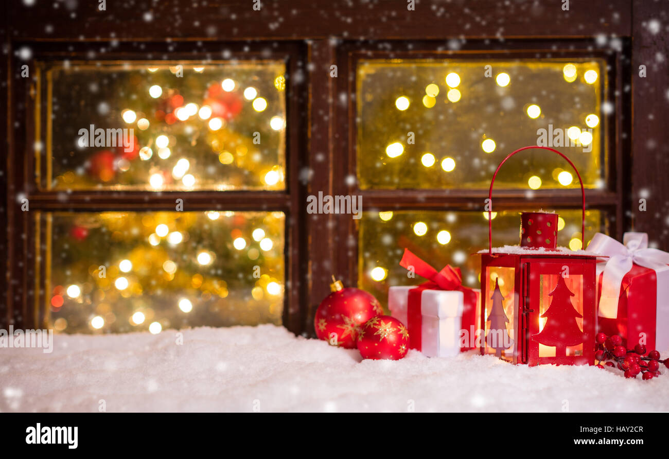 Atmospheric Christmas window sill with decoration and blur tree wth