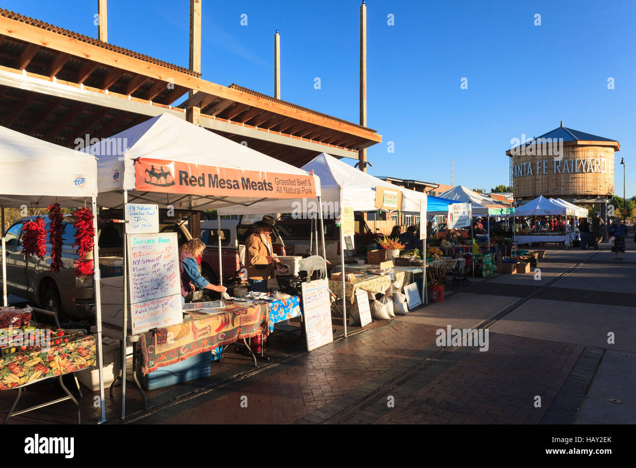Vendors at the Santa Fe Saturday Farmer's  Market next to the rail yard display their goods for sale, Santa Fe New Mexico USA. Stock Photo