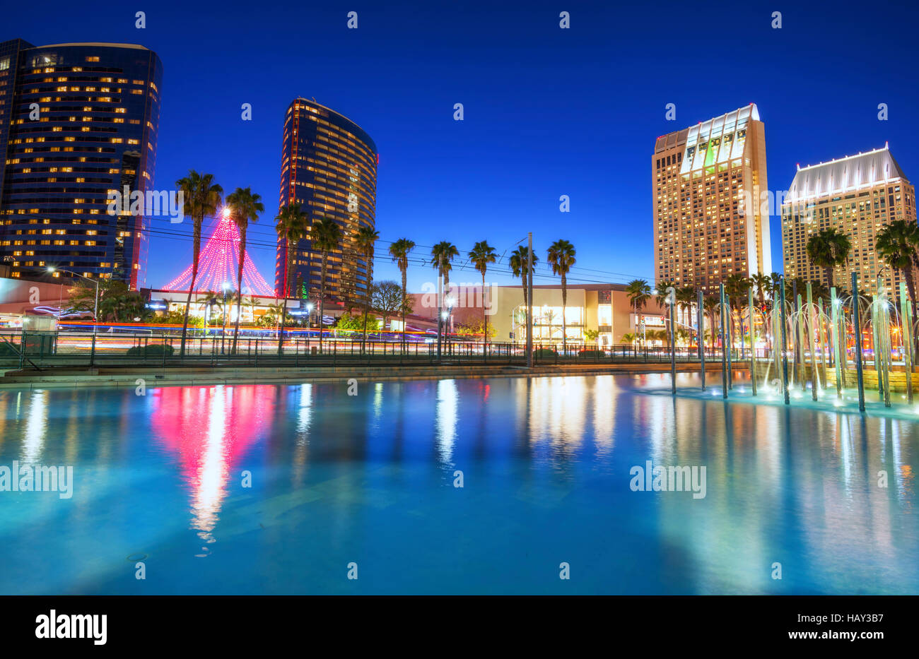 Downtown San Diego buildings reflecting in a pond at night. San Diego