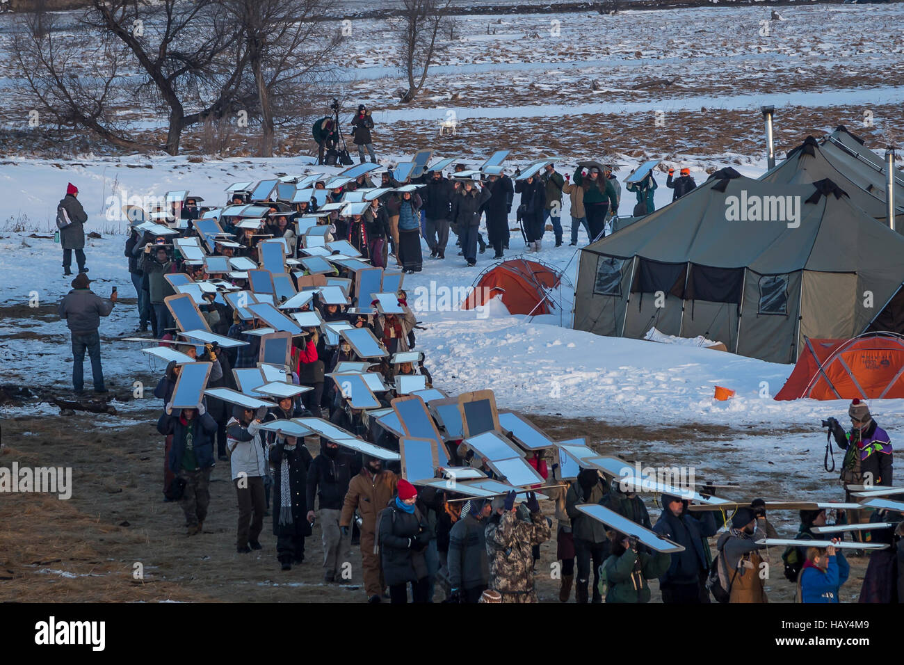 Cannonball, United States. 03rd Dec, 2016. There is a long history of using mirrors at protests, to show the oppressors themselves as they brutalize those protesting injustice. Veterans arrived en mass to Standing Rock, bringing a massive amount of supplies including winter clothing, food and firewood by the truck load. Over 5000 veterans are anticipated to arrive by Sunday evening, prior to various actions slated to place. Credit:  Michael Nigro/Pacific Press/Alamy Live News Stock Photo