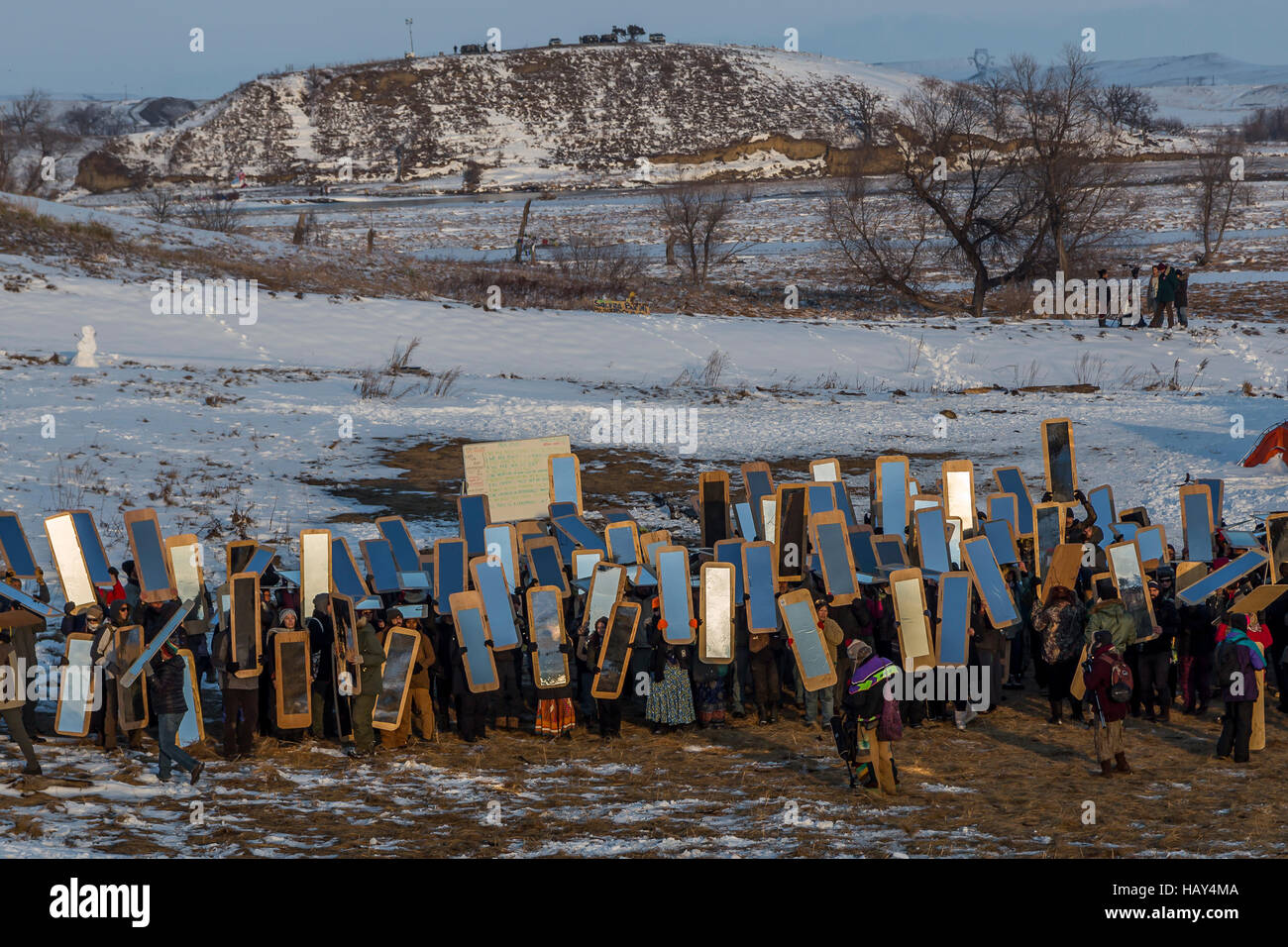 Cannonball, United States. 03rd Dec, 2016. There is a long history of using mirrors at protests, to show the oppressors themselves as they brutalize those protesting injustice. Veterans arrived en mass to Standing Rock, bringing a massive amount of supplies including winter clothing, food and firewood by the truck load. Over 5000 veterans are anticipated to arrive by Sunday evening, prior to various actions slated to place. Credit:  Michael Nigro/Pacific Press/Alamy Live News Stock Photo