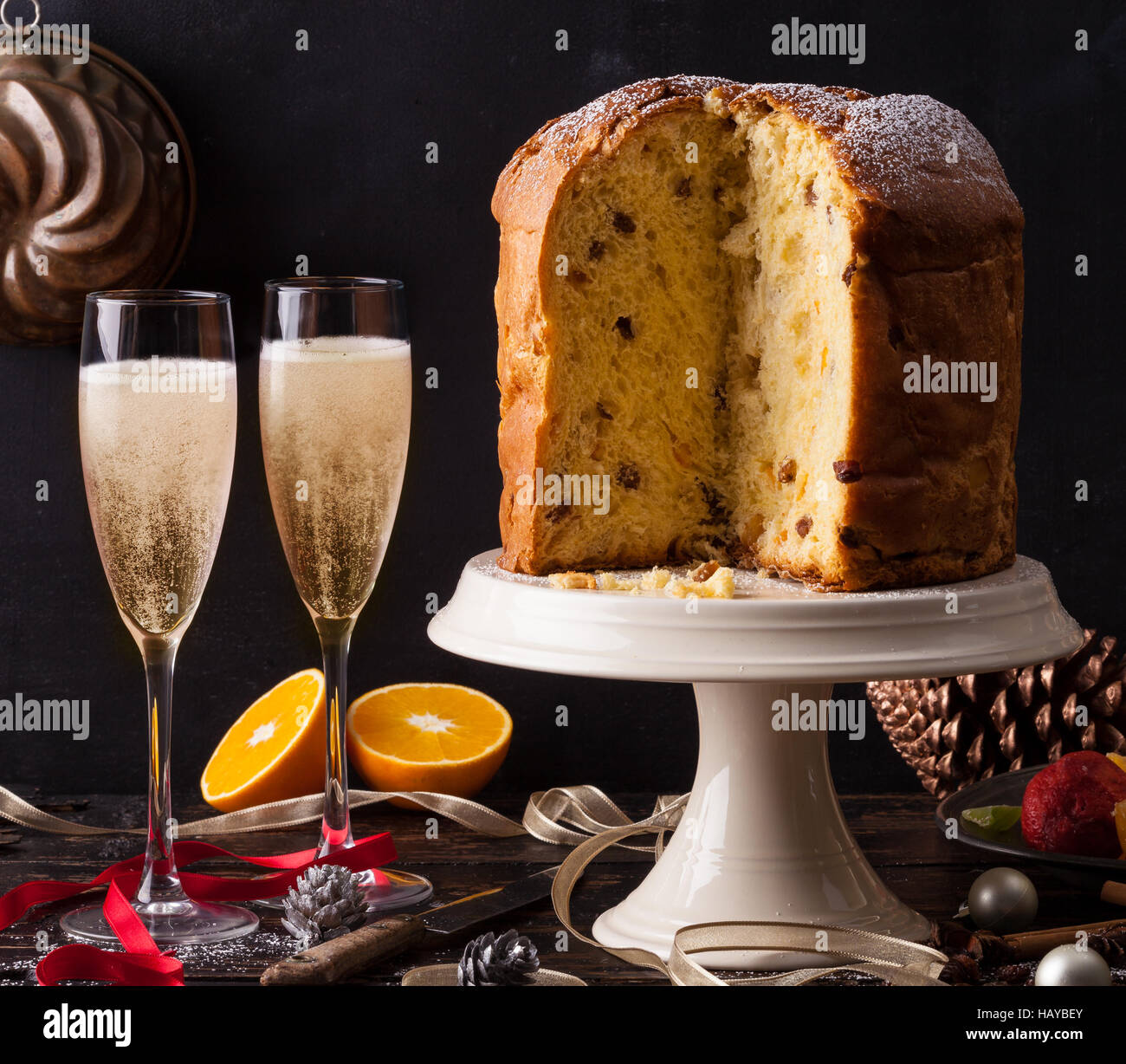 Italian panettone Christmas cake with sparkling wine, prosecco or champagne. Stock Photo