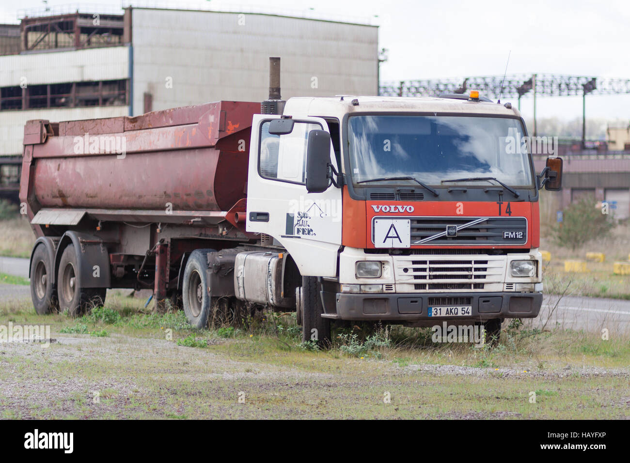 Truck in abandoned metal factory Stock Photo