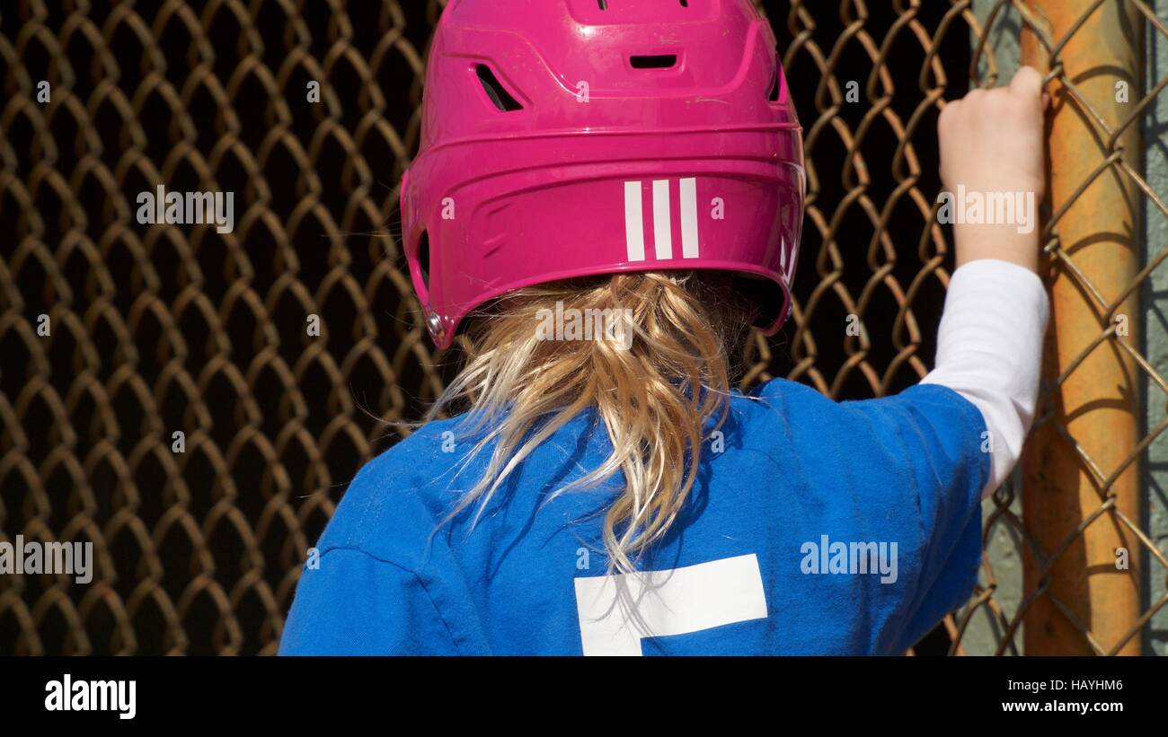 Little girl in Pink baseball helmet Stock Photo Alamy