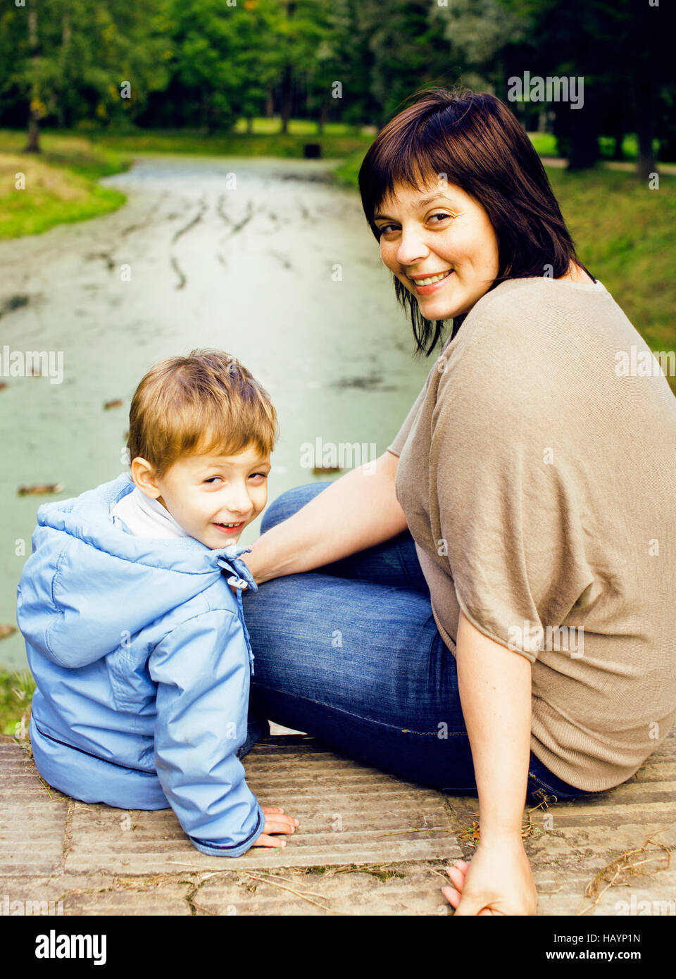 mature woman with little boy outside, mother with son in green p Stock  Photo - Alamy