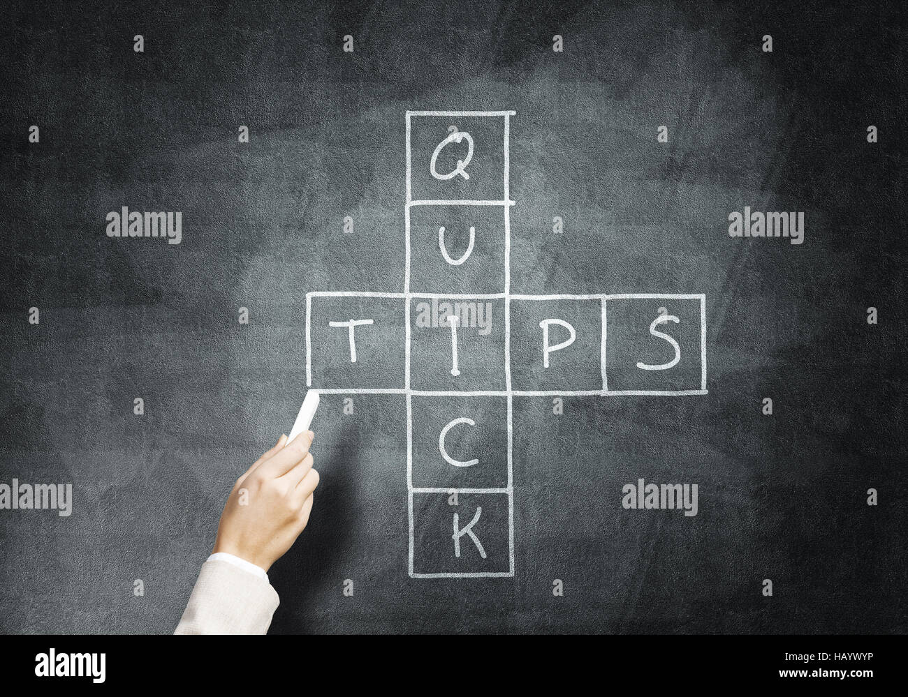 Woman draw crossword Stock Photo Alamy