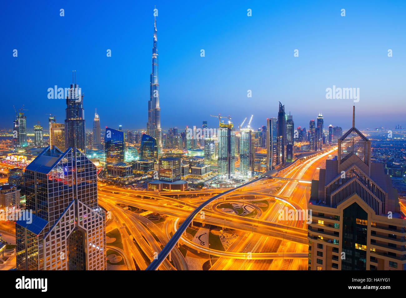 View on modern skyscrapers and busy evening highways in luxury Dubai city,Dubai,United Arab Emirates Stock Photo