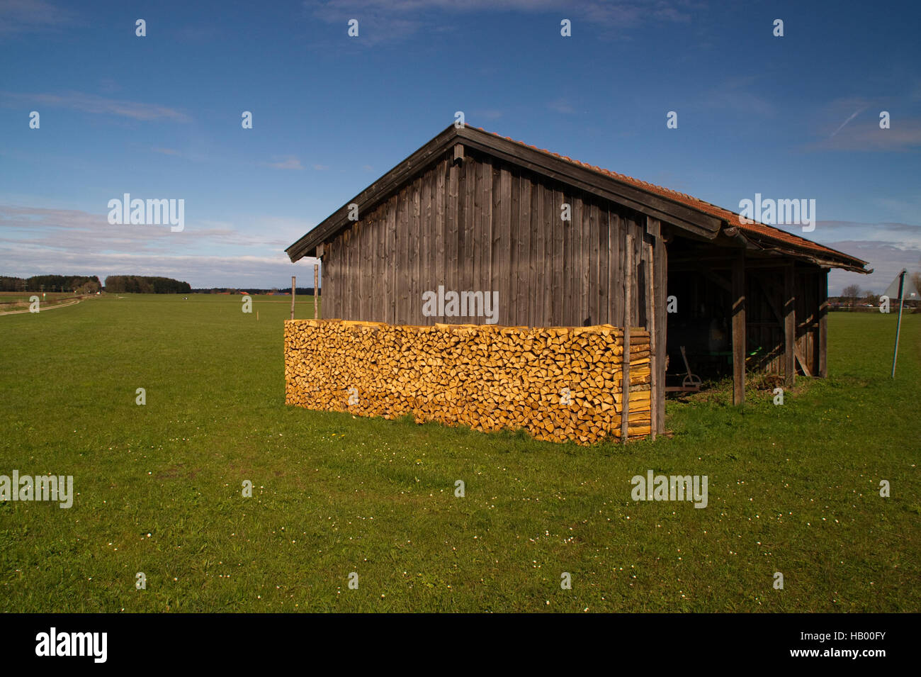 Barn, Firewood, sky, blue, meadow, pasture Stock Photo Alamy