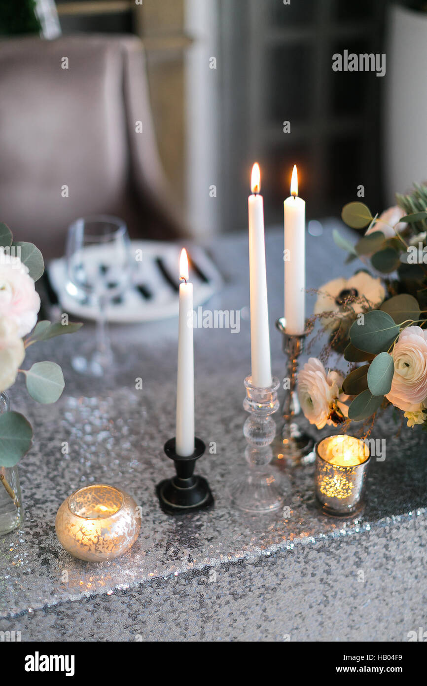 Wedding decor.  interior. Festive . The burning candles on a table. Stock Photo