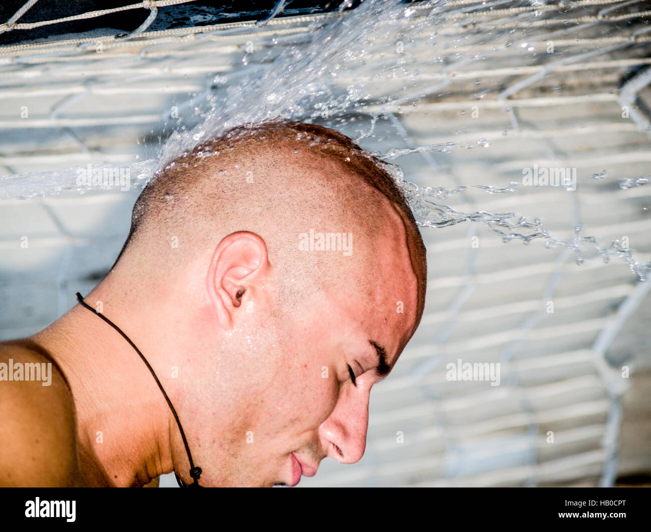 Male Splashed  with Water Stock Photo