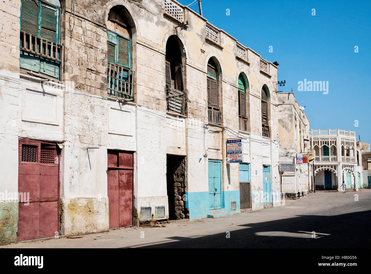 local red sea style architecture street in central massawa old town eritrea Stock Photo