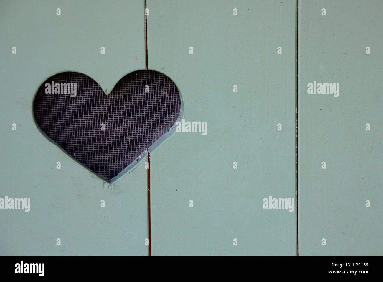 close up of a wooden door with hearts Stock Photo