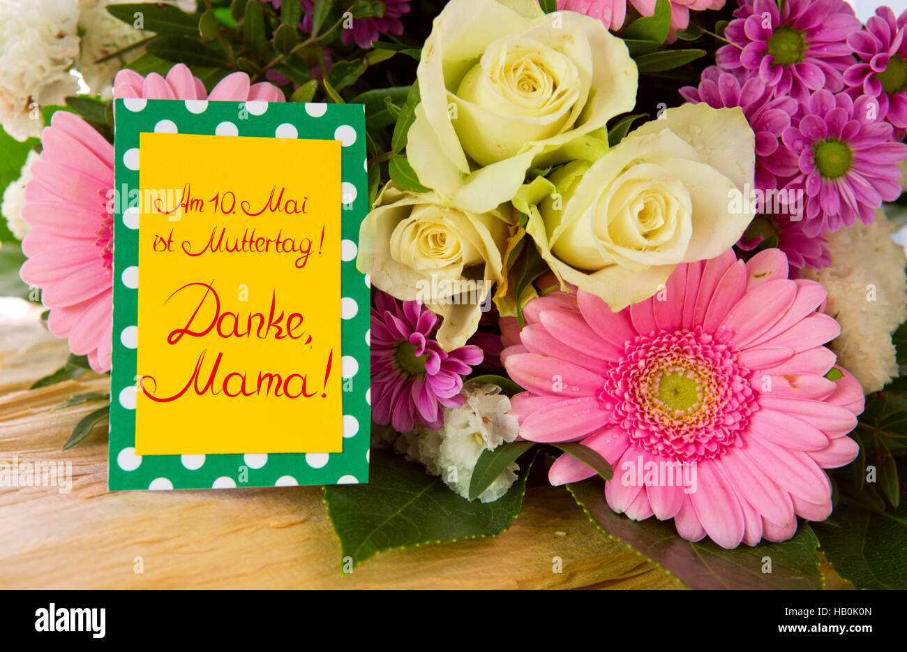 Colorful flowers bouquet and yellow card Stock Photo Alamy