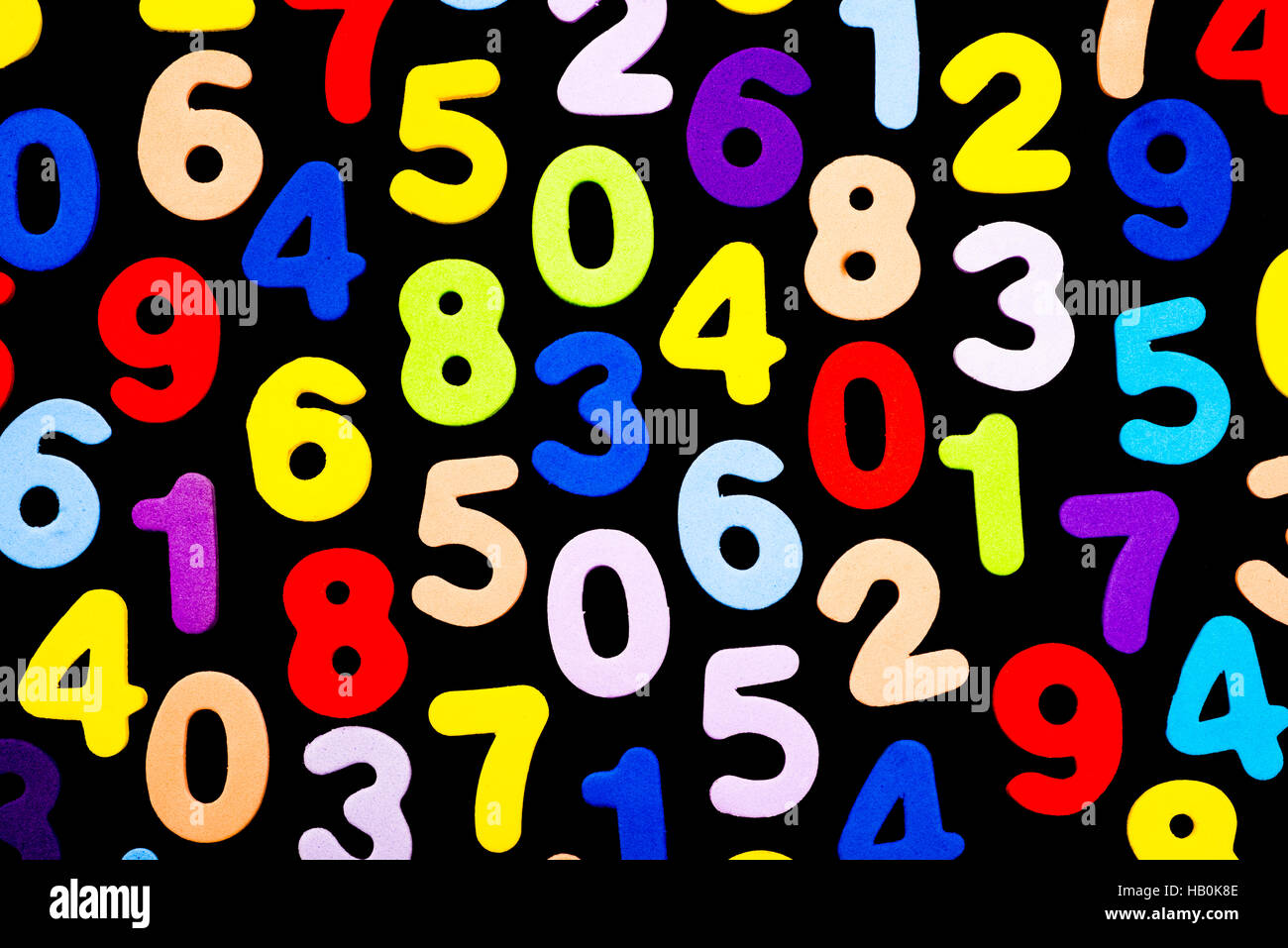 Brightly coloured numbers on black background Stock Photo
