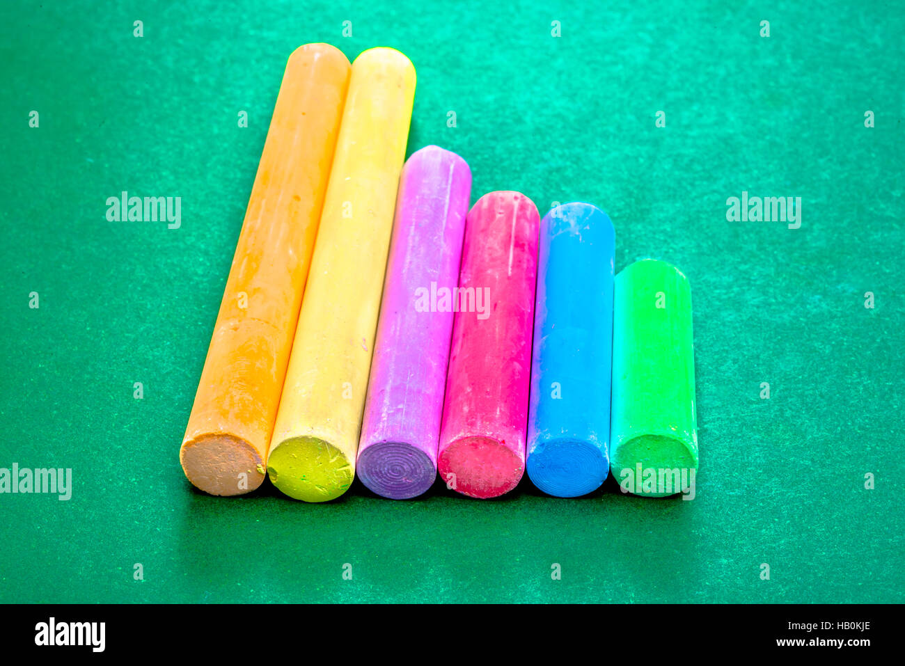 Six Pieces of Chalk in a Line Stock Photo