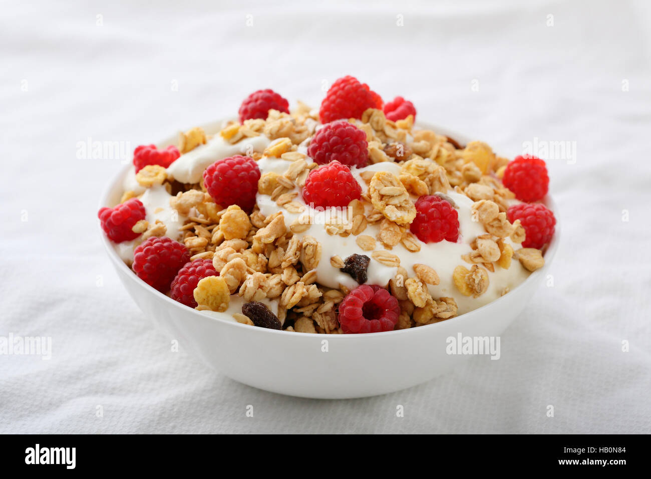 Raspberry granola with yogurt, food closeup Stock Photo
