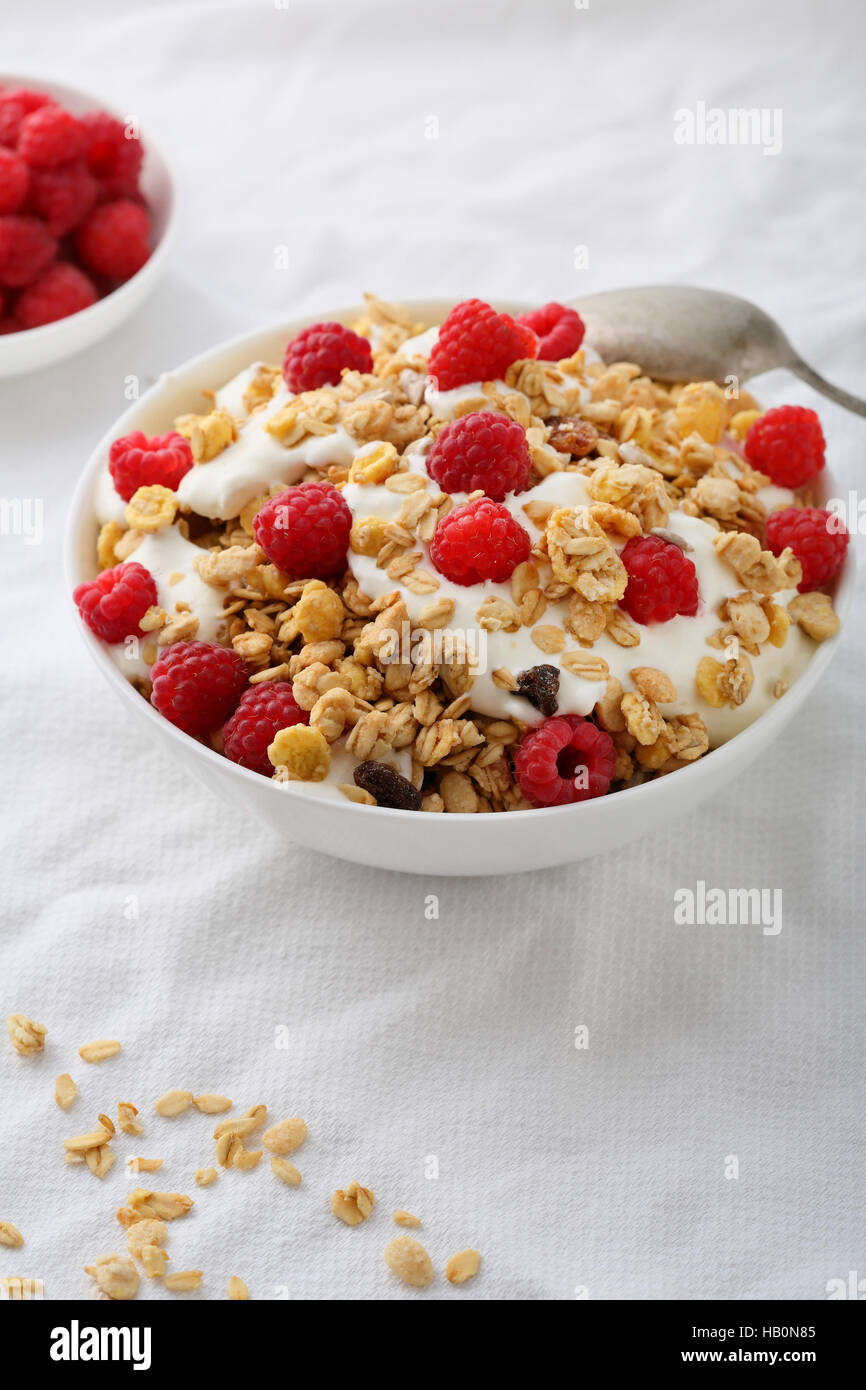 Raspberry breakfast with yogurt in bowl Stock Photo