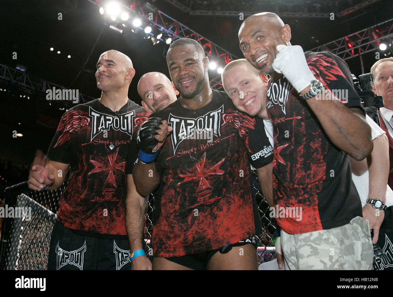 UFC fighter Rashad Evans, center, celebrates his victory over Quinton