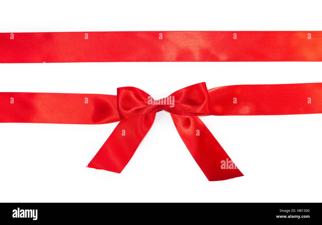 Red horizontal gift ribbons and luxurious bow isolated on white