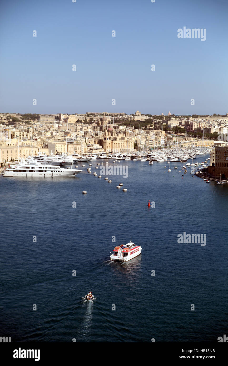 Upright view of ferry crossing Grand Harbor Valletta Malta to Three Cities Senglea Stock Photo
