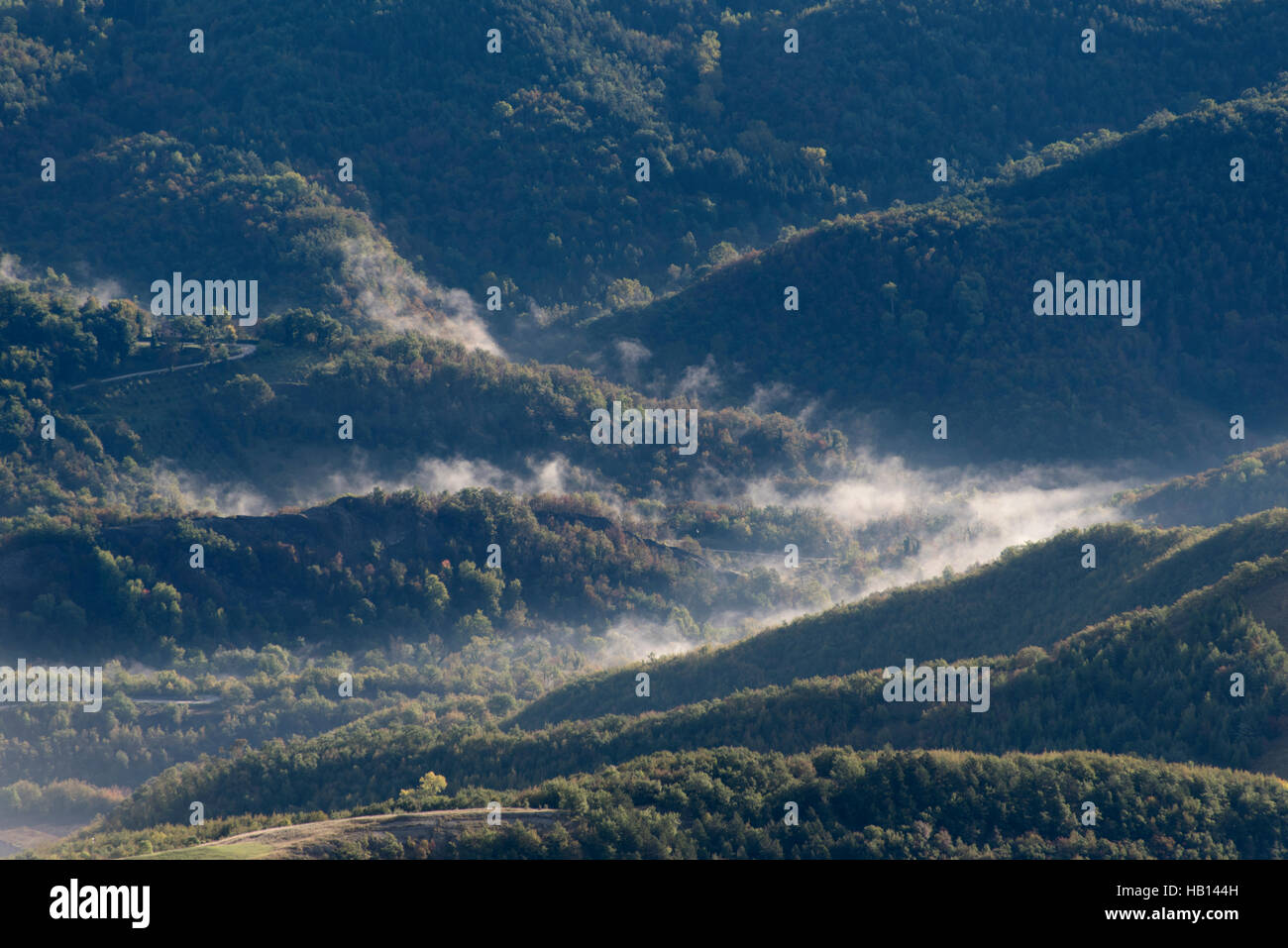 View from Mount Sibillini into valleys under morning mist Stock Photo
