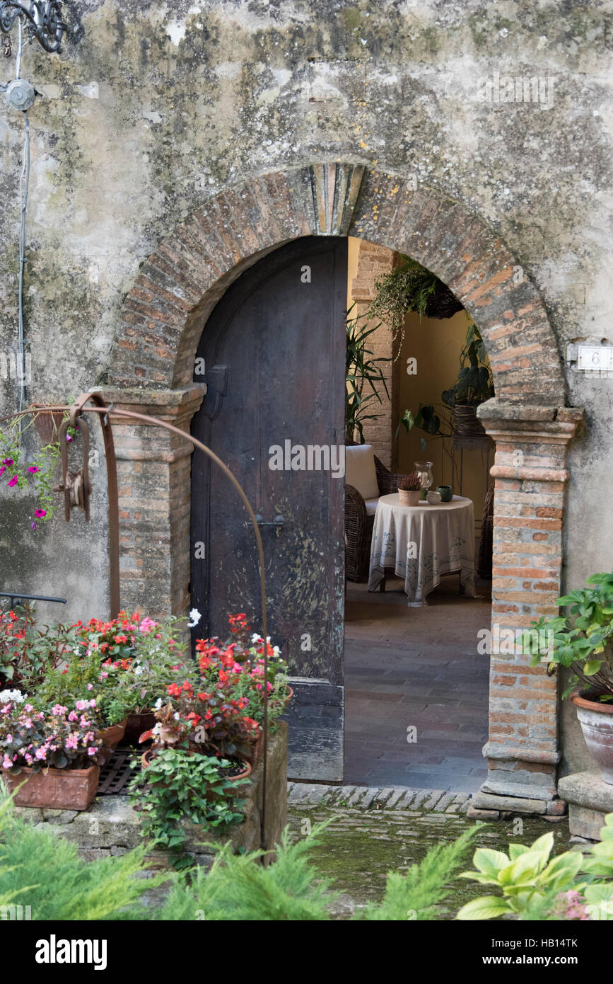 Open door revealing a private courtyard Stock Photo
