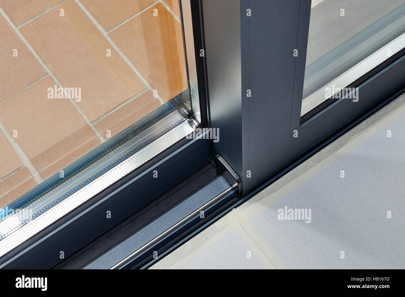 Sliding glass door detail and rail embed in floor Stock Photo