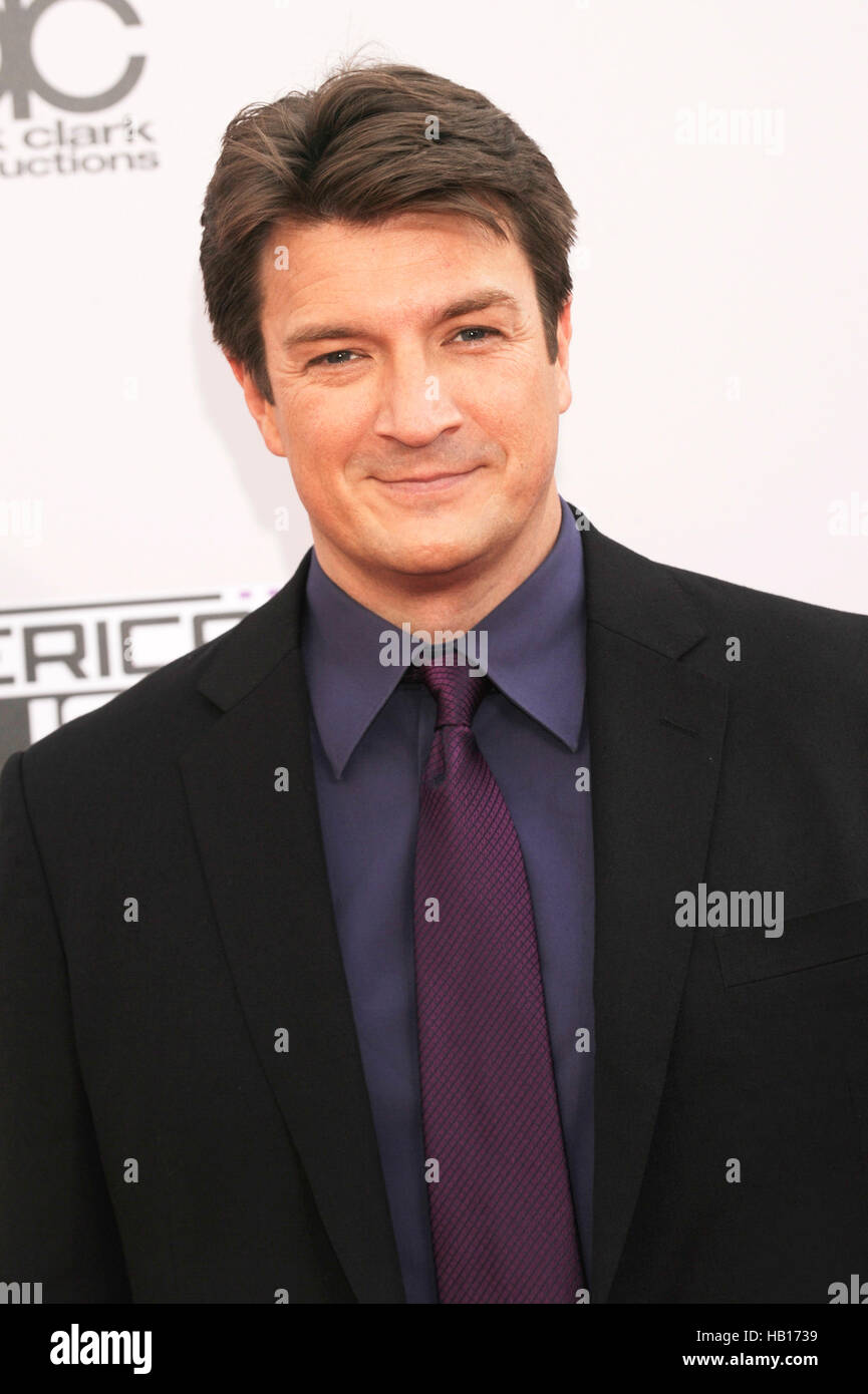 Nathan Fillion arrives for the American Music Awards at Nokia Theatre L.A. Live on November 23, 2014 in Los Angeles, California. Stock Photo