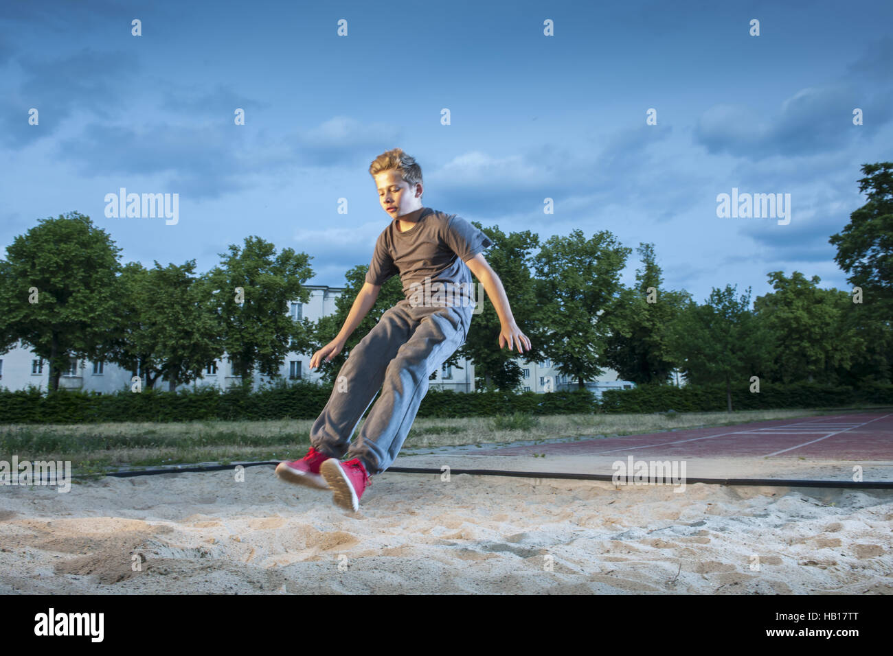 long jump of teen boy Stock Photo