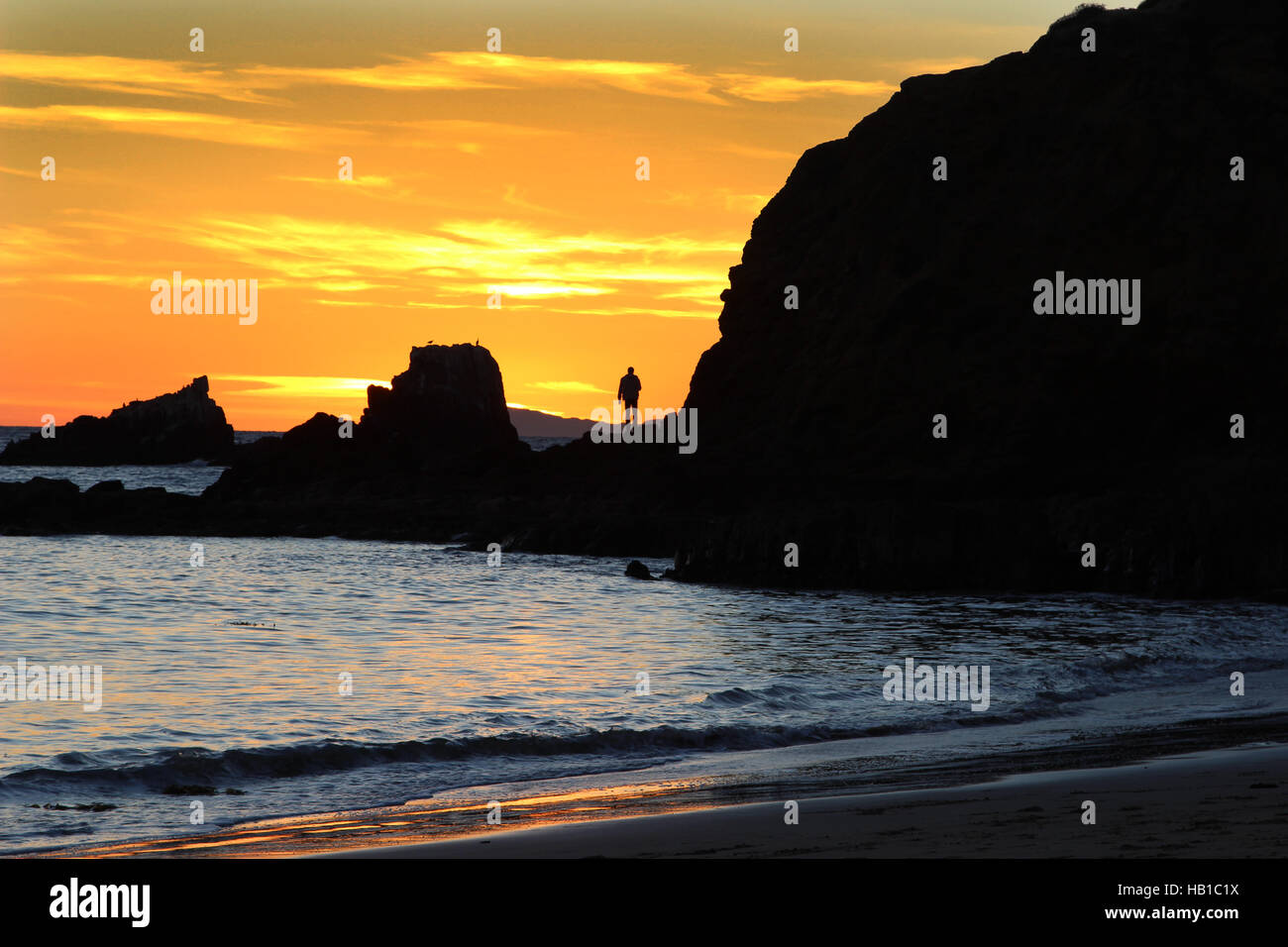 Silhouette of a man at sunset Stock Photo - Alamy
