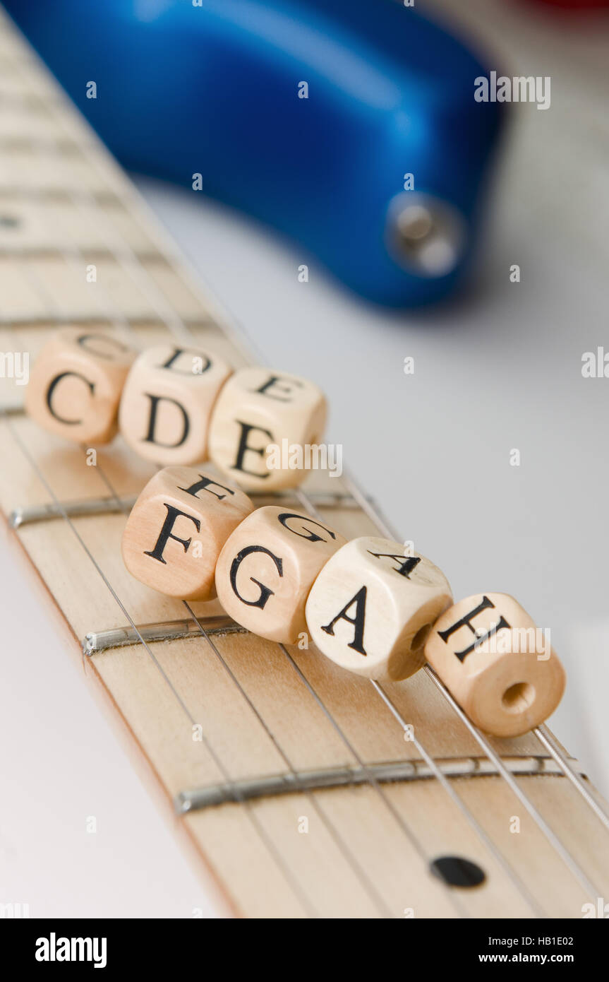 seven cubes on guitar stings Stock Photo