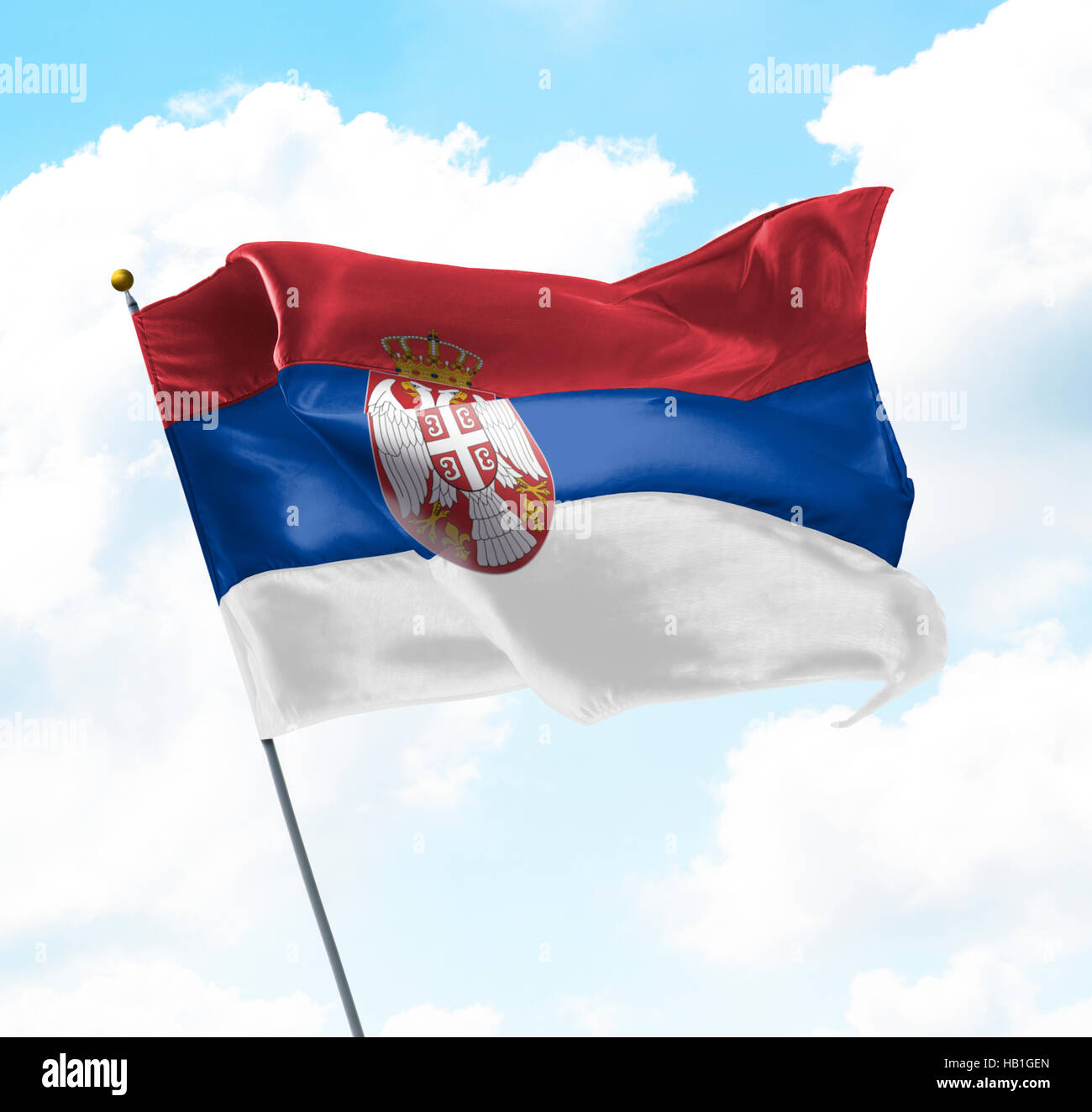 Flag of Serbia Raised Up in The Sky Stock Photo