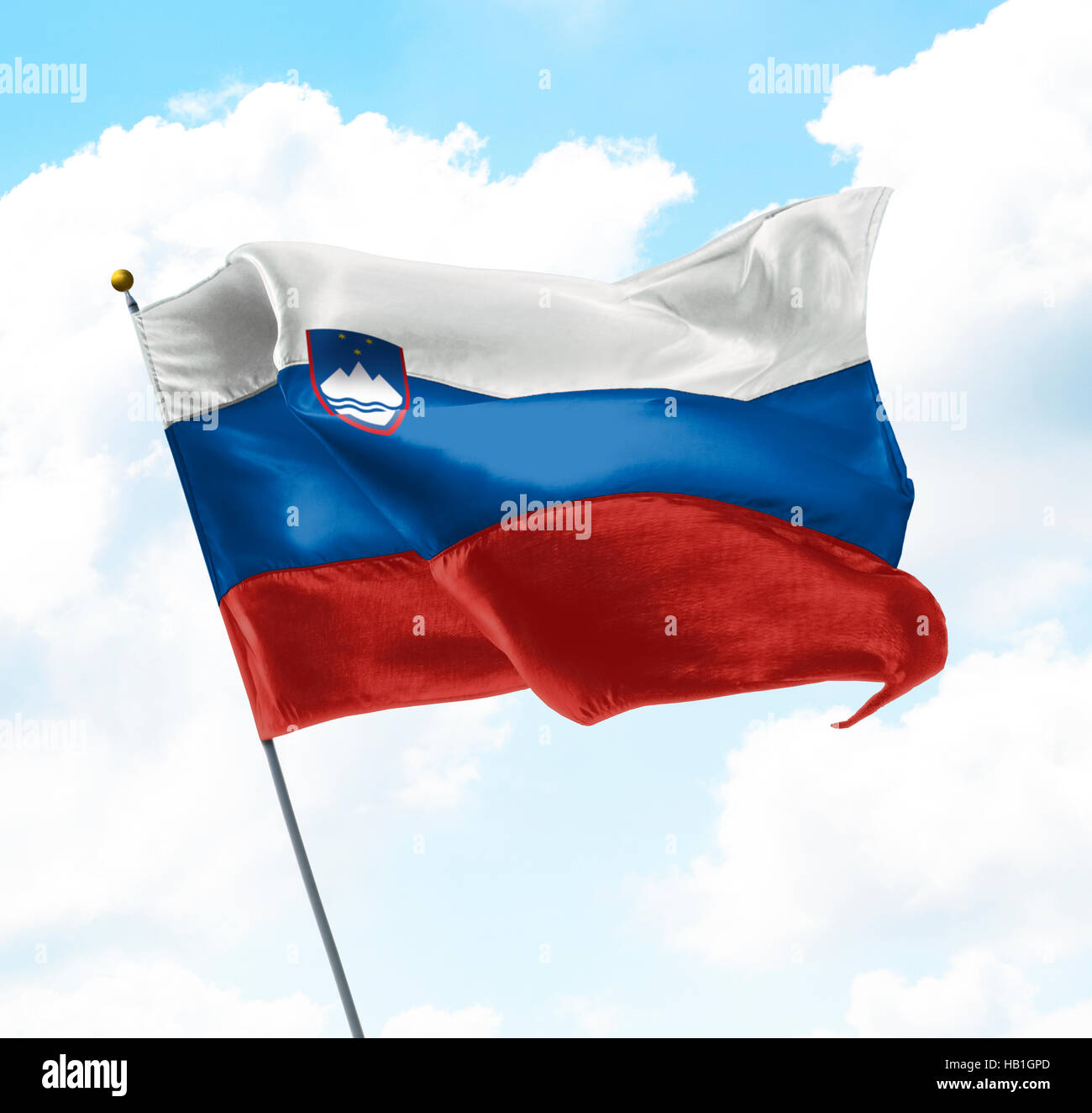 Flag of Slovenia Raised Up in The Sky Stock Photo