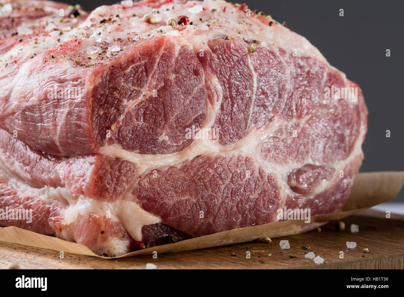 Photo of raw meat. Pork neck with herbs Stock Photo - Alamy