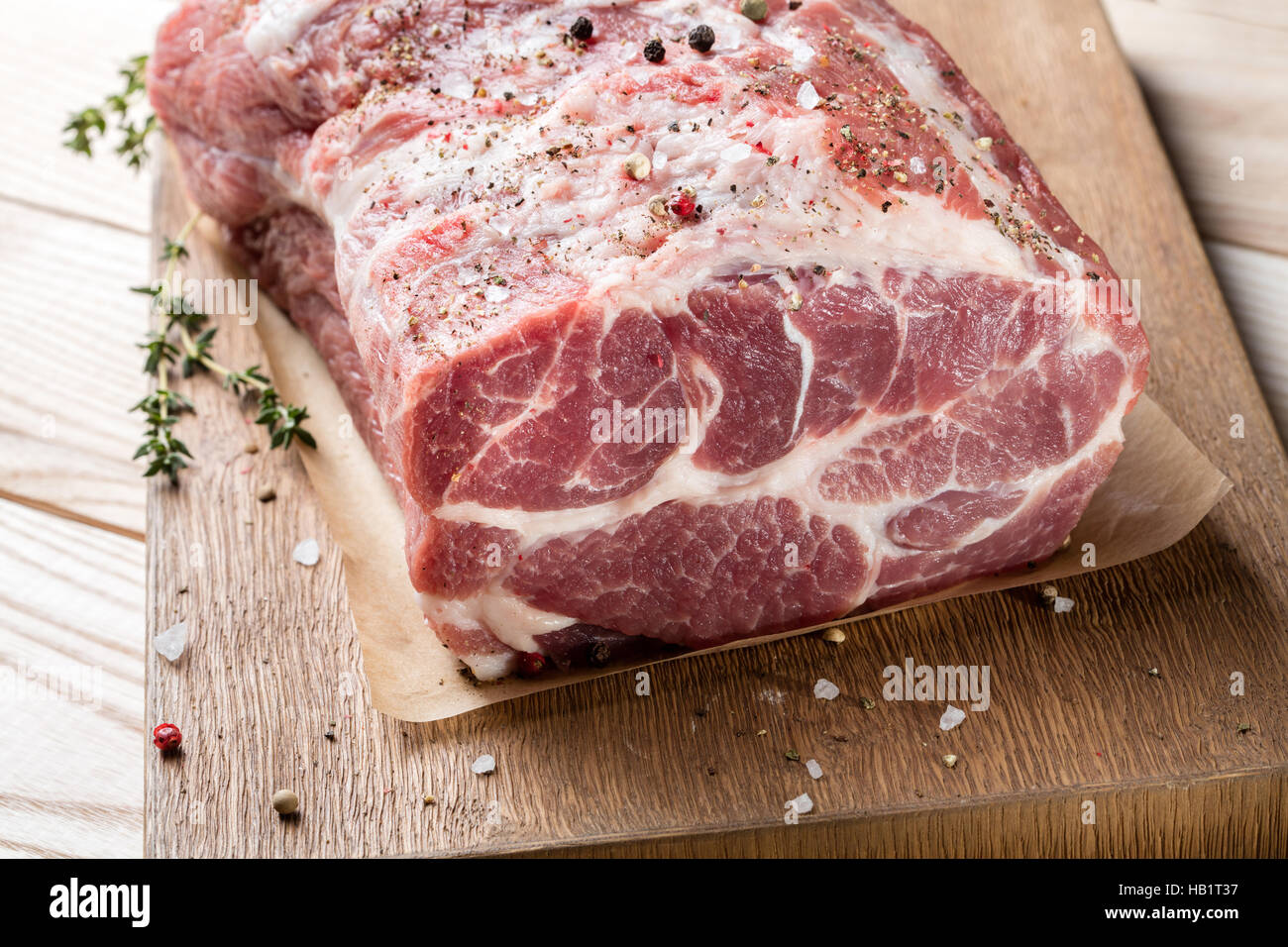 Photo of raw meat. Pork neck with herbs Stock Photo - Alamy
