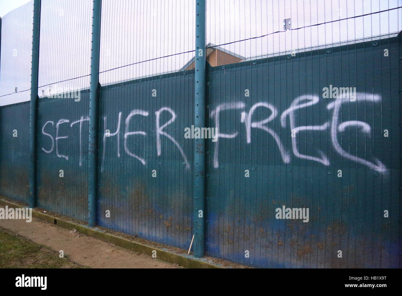 Yarls Wood Detention Centre, Bedford, UK. 3rd December, 2016. Graffiti sprayed on the fence. Nearly 2000 demonstrators protest at the fence of the centre, calling for Yarls Wood Detention Centre to be closed down. Penelope Barritt/Alamy Live News Stock Photo