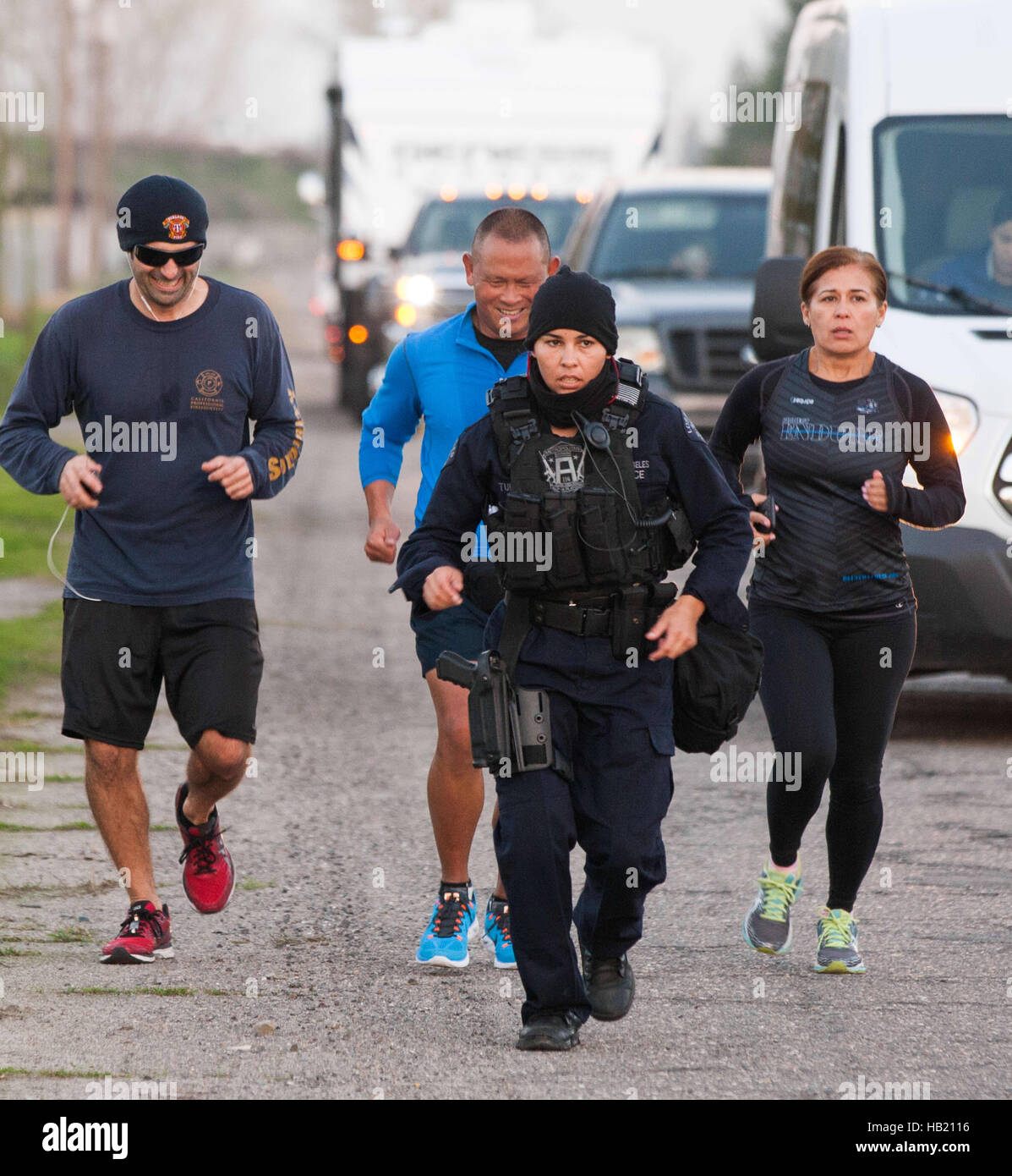 Turlock, CA, USA. 3rd Dec, 2016. Los Angeles Police Officer Kristina Tudor runs through Merced County and into Stanislaus County Saturday Dec. 3rd 2016 evening on her and Officer Joe Cirrito 420 mile run to Sacramento California from Los Angeles. The run is to raise awareness, funds and to honor the officers killed in the line of duty. Along with the families of officers killed in the line of duty. © Marty Bicek/ZUMA Wire/Alamy Live News Stock Photo