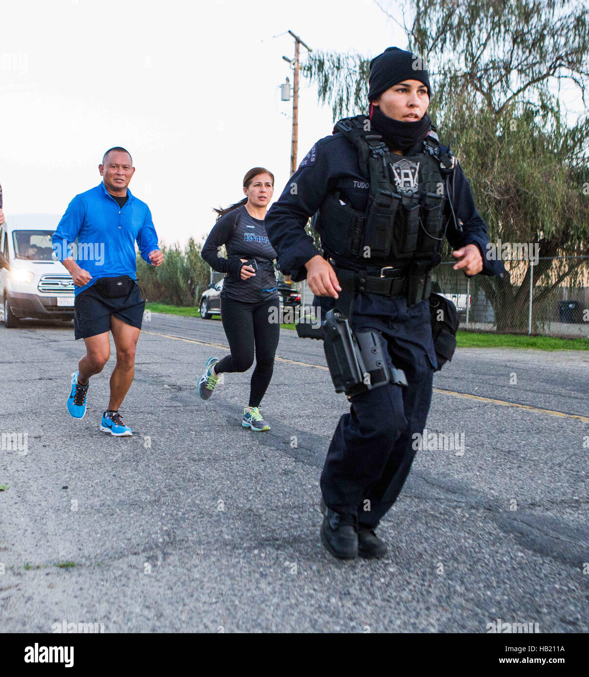 Turlock, CA, USA. 3rd Dec, 2016. Los Angeles Police Officer Kristina Tudor had a few followers as she ran through Merced County and into Stanislaus County Saturday Dec. 3rd 2016 evening on her and Officer Joe Cirrito 420 mile run to Sacramento California from Los Angeles. The run is to raise awareness, funds and to honor the officers killed in the line of duty. Along with the families of officers killed in the line of duty. © Marty Bicek/ZUMA Wire/Alamy Live News Stock Photo