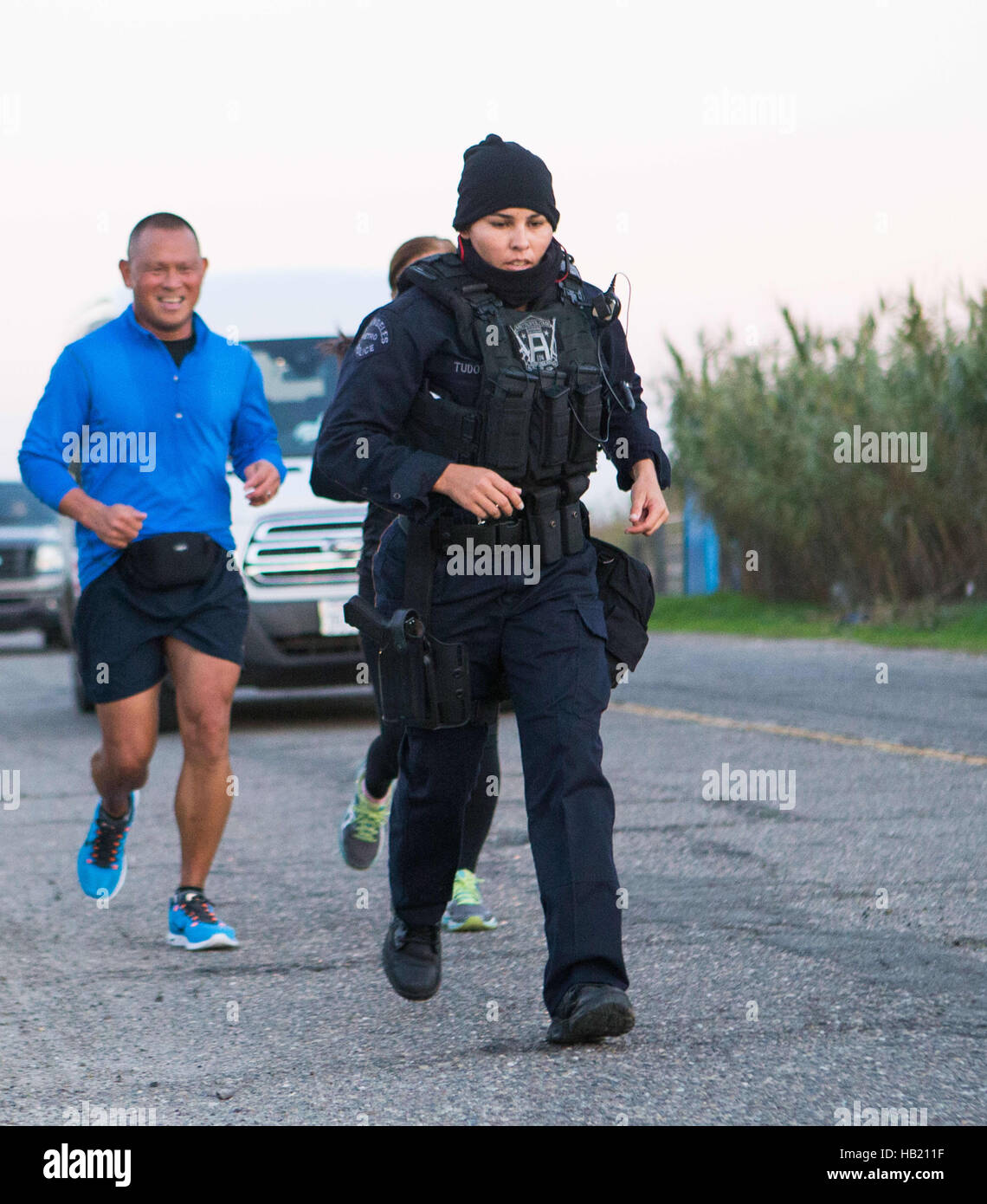 Turlock, CA, USA. 3rd Dec, 2016. Los Angeles Police Officer Kristina Tudor had a few followers as she ran through Merced County and into Stanislaus County Saturday Dec. 3rd 2016 evening on her and Officer Joe Cirrito 420 mile run to Sacramento California from Los Angeles. The run is to raise awareness, funds and to honor the officers killed in the line of duty. Along with the families of officers killed in the line of duty. © Marty Bicek/ZUMA Wire/Alamy Live News Stock Photo