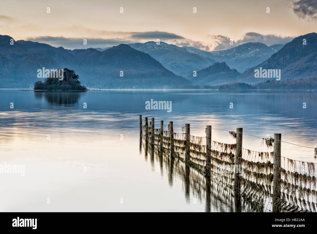Derwentwater, Keswick, Cumbria, UK. 4th Dec, 2016. Dawn on the lake at the start of a frosty and sunny day in the Lake District. The cold and clear wintery weather is forecast to continue until midweek. Credit:  Julian Eales/Alamy Live News Stock Photo
