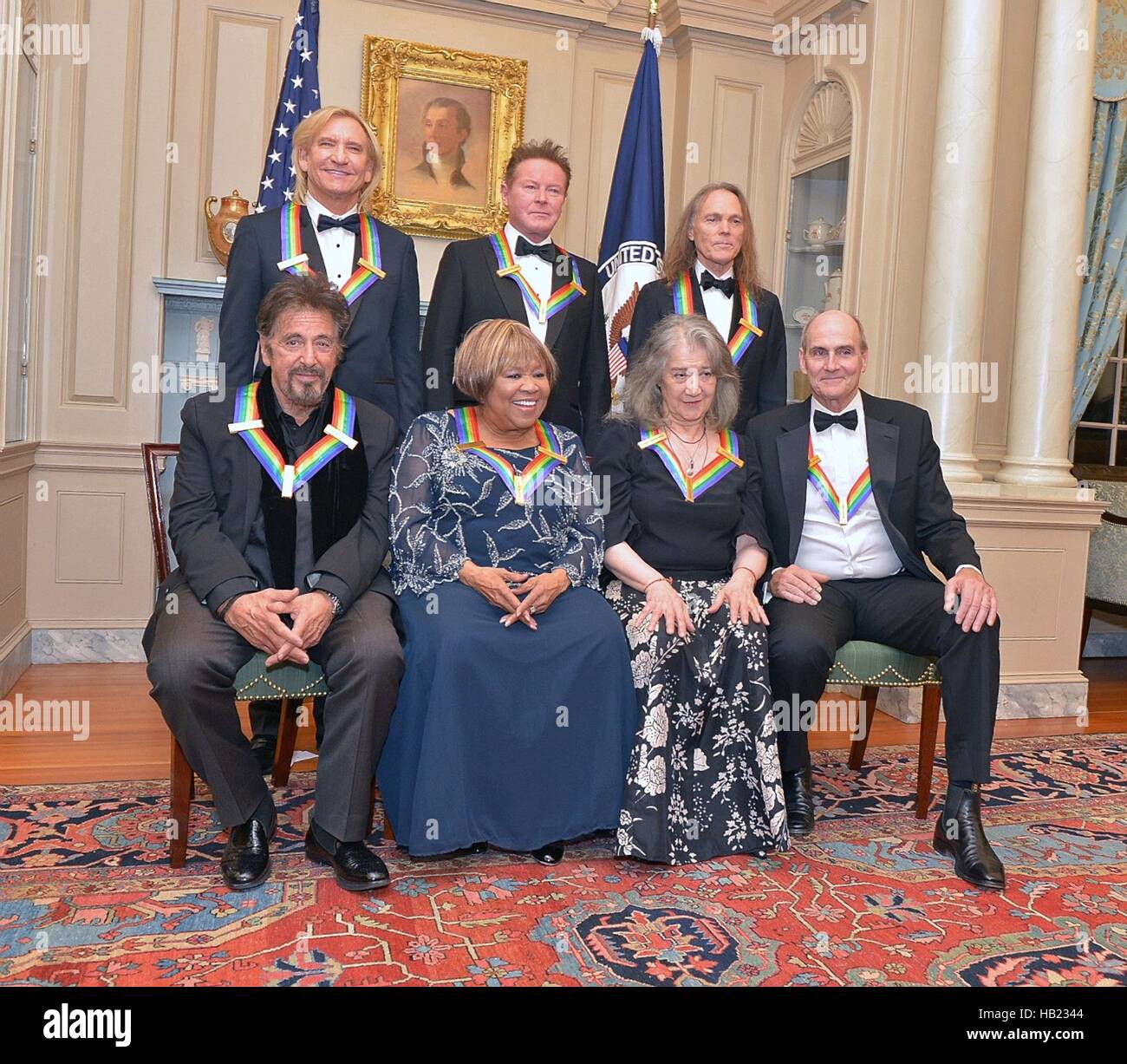 The 2016 Kennedy Center Honor Award recipients pose for a group photo following the gala dinner at the Department of State December 3, 2016 in Washington, DC. First row left to right are: Al Pacino, Mavis Staples, Martha Argerich and James Taylor; back row, from left: Joe Walsh, Don Henley and Timothy Schmit. Stock Photo