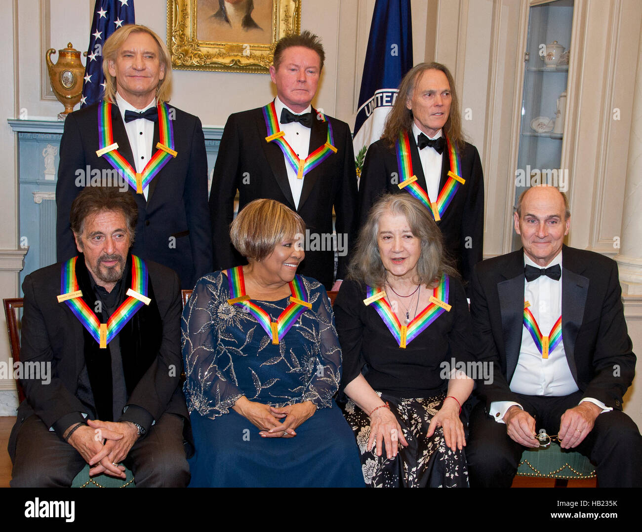 The five recipients of the 39th Annual Kennedy Center Honors pose for a group photo following a dinner hosted by United States Secretary of State John F. Kerry in their honor at the U.S. Department of State in Washington, DC on Saturday, December 3, 2016. From left to right back row: Joe Walsh, Don Henley, and Timothy B. Schmidt of the rock band "The Eagles." Front row, left to right: Al Pacino, Mavis Staples, Martha Argerich, and James Taylor. The 2016 honorees are: Argentine pianist Martha Argerich; rock band the Eagles; screen and stage actor Al Pacino; gospel and blues singer Mavis Stapl Stock Photo